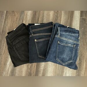3 pairs of Guess jeans.